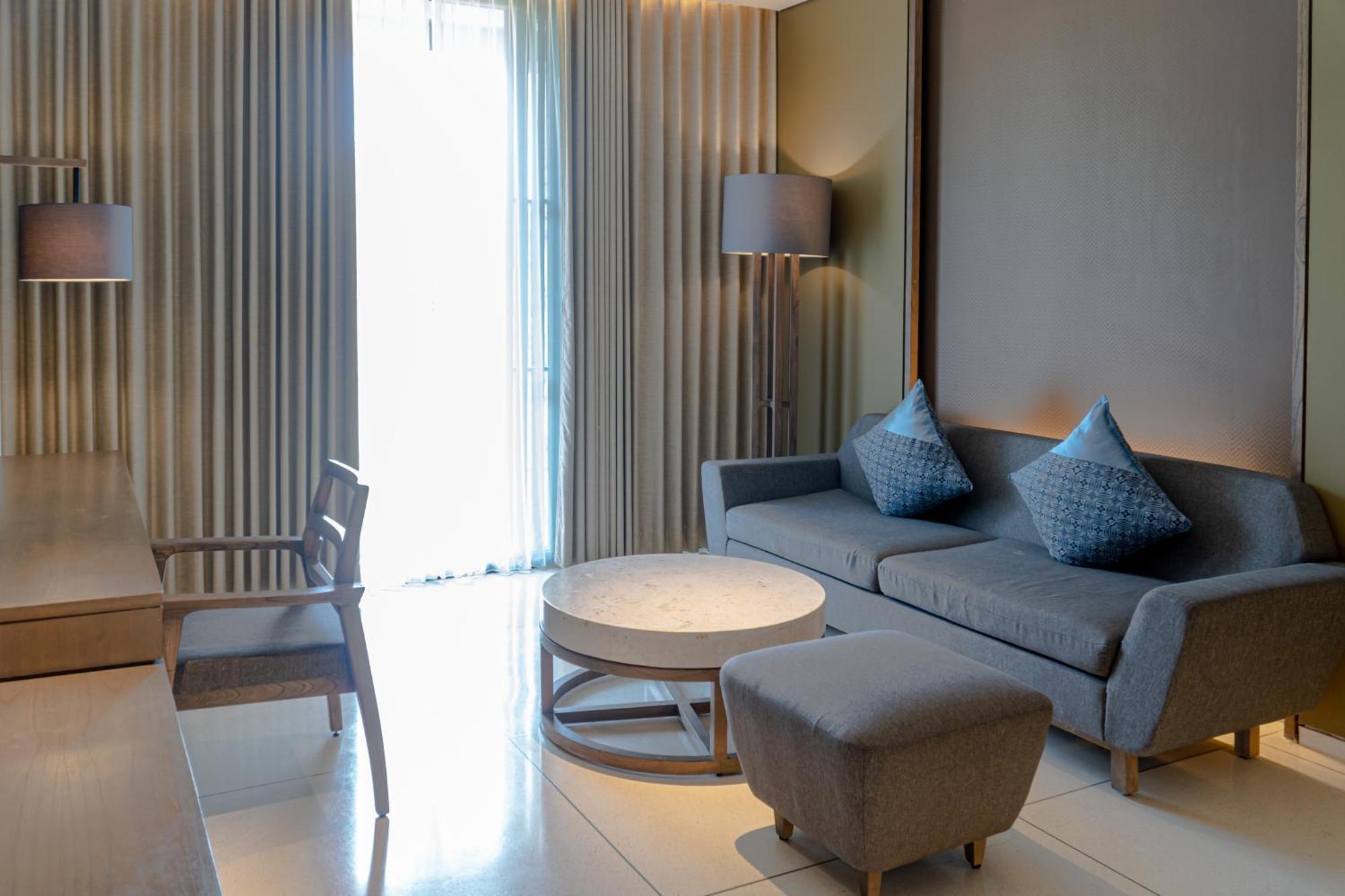 Wyndham Tamansari Jivva Resort Bali Siyut Kültér fotó A living room at the hotel
