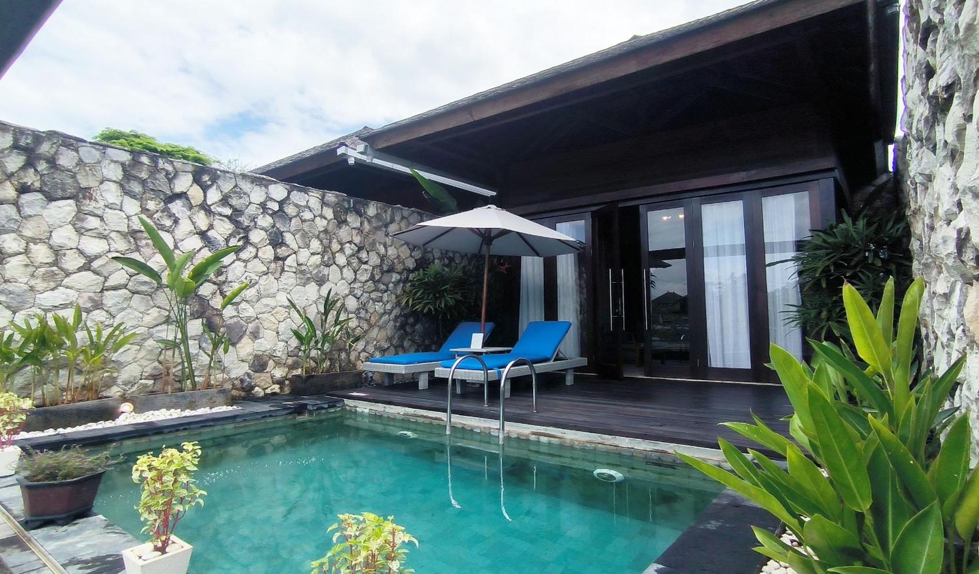 Wyndham Tamansari Jivva Resort Bali Siyut Kültér fotó A pool villa at the resort